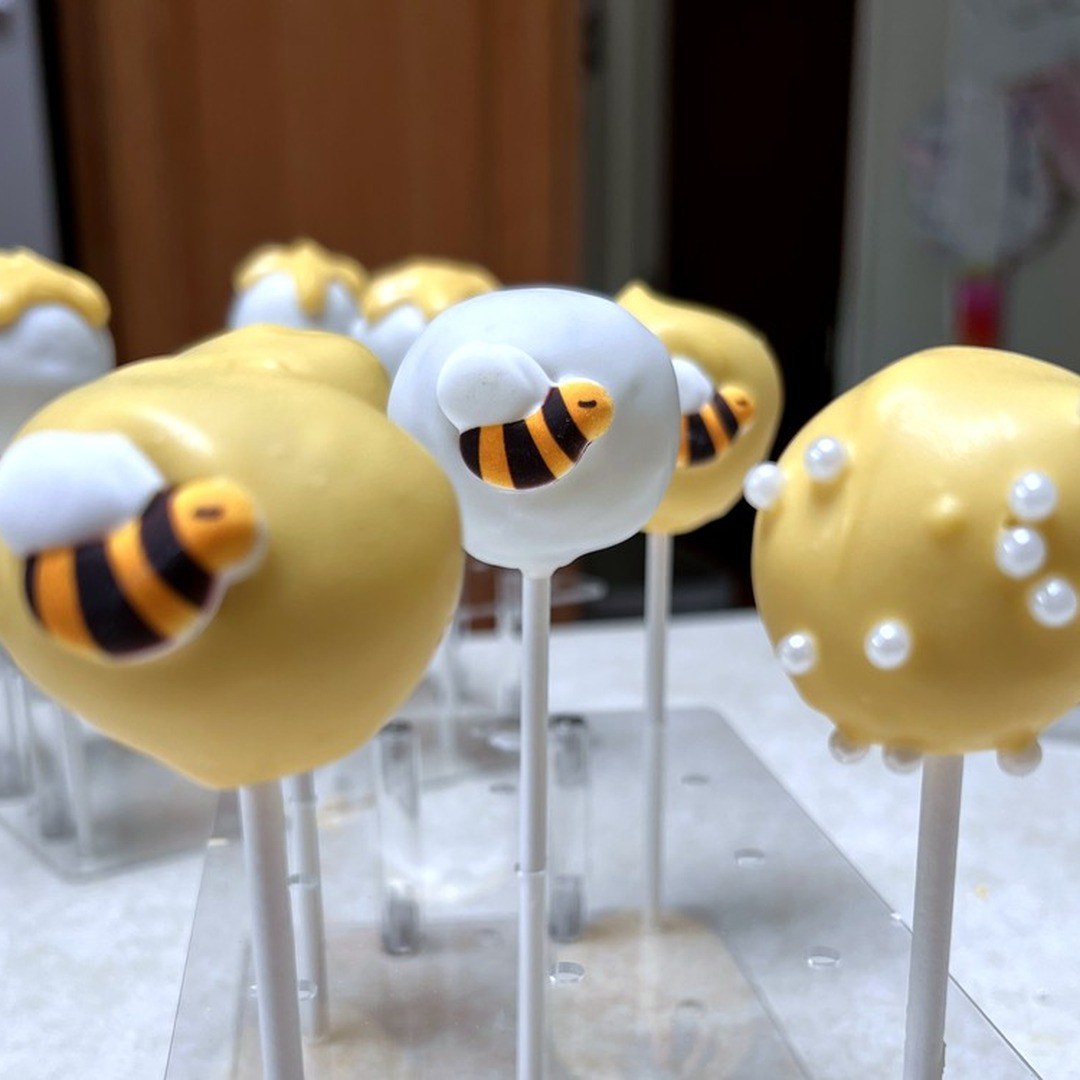 Custom bee themed cake pops from an Olivia's Treats example build